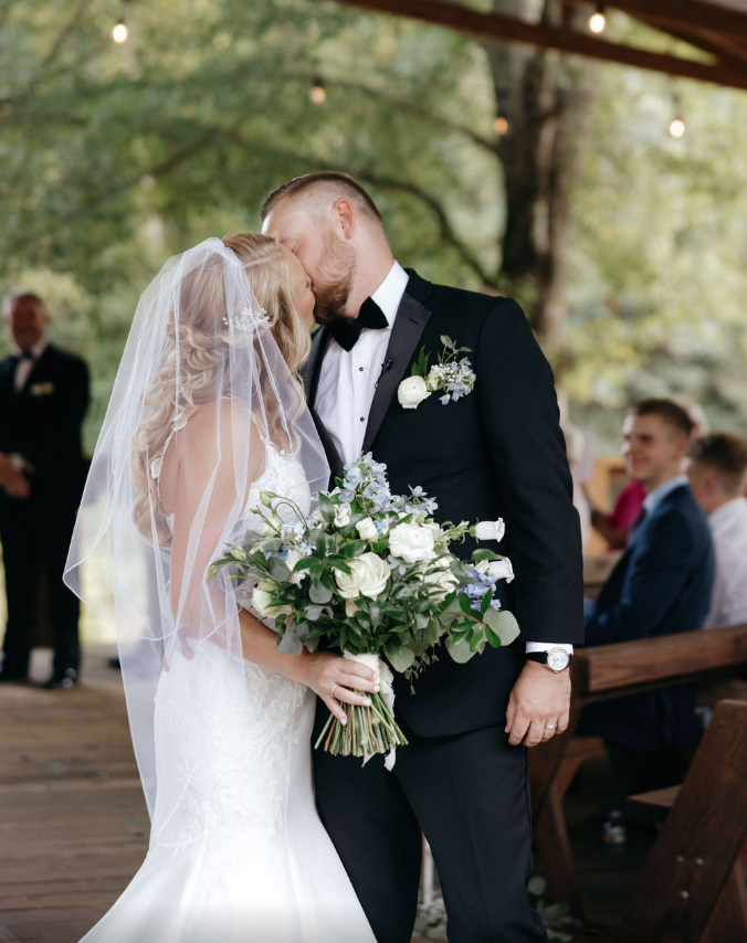 Bride and groom kissing after ceremony